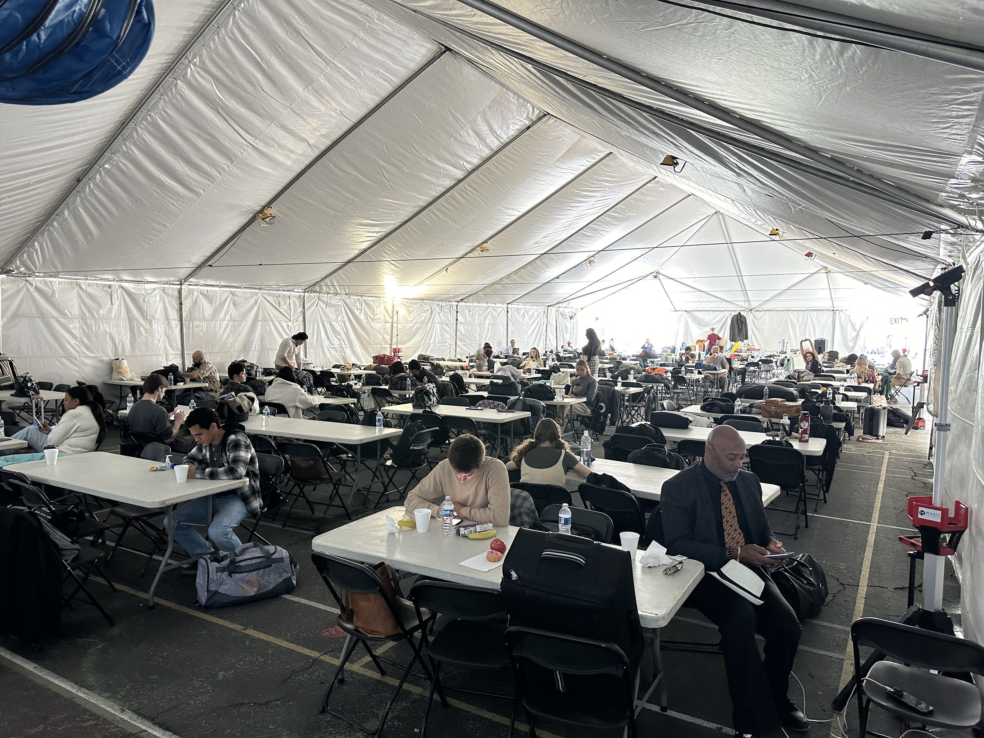 Frame tent seating a full crew for lunch