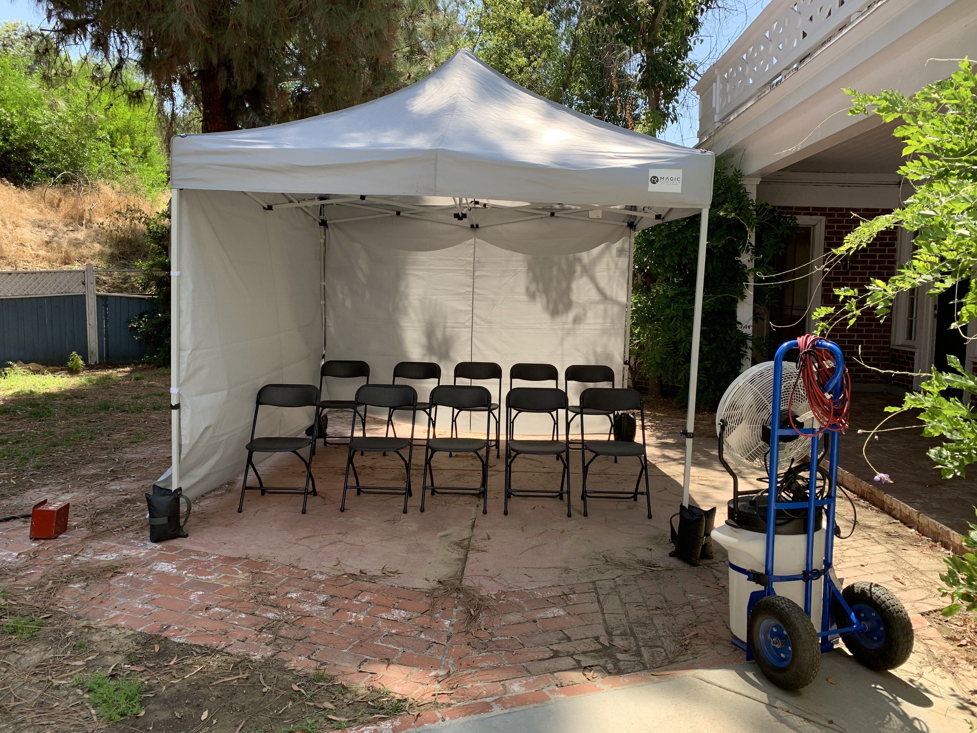 Background holding tent with seating