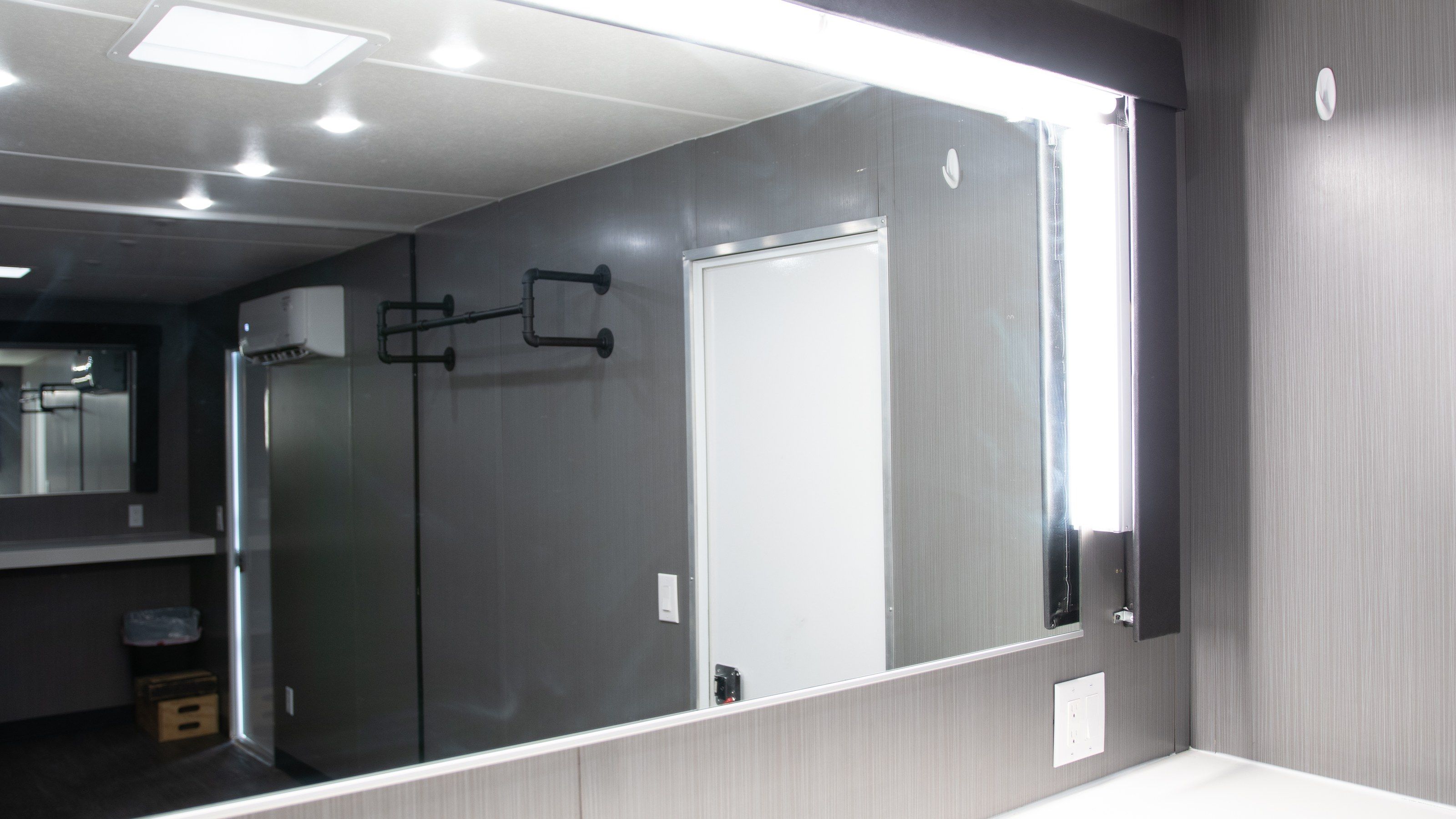 Lit vanity wall inside a trailer